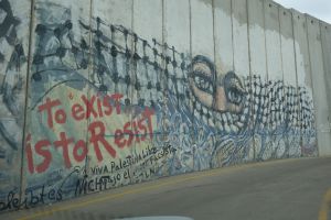 Graffiti on a segment of the massive wall that divides Israel and the West Bank. 